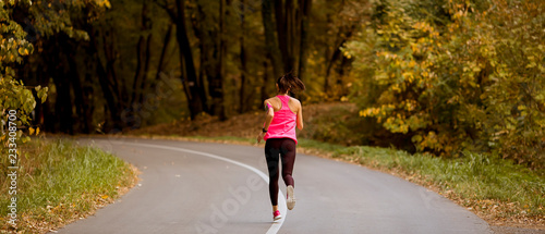 Young fitness woman running...