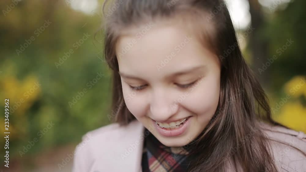 Young attractive girl, caught a cold on the street, wipes her nose with a napkin. Young attractive girl, caught a cold on the street, wipes her nose with a napkin.