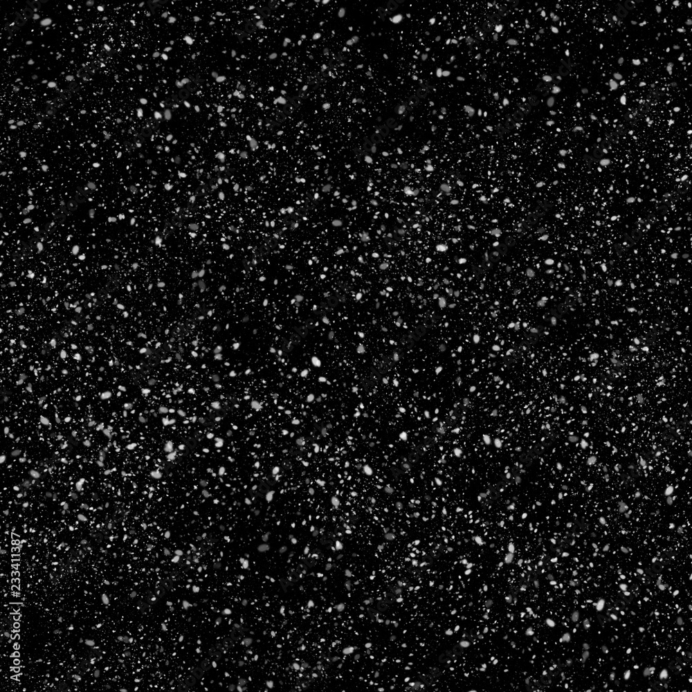 Isolated natural white snow texture effect on black night background. Winter snowflakes.