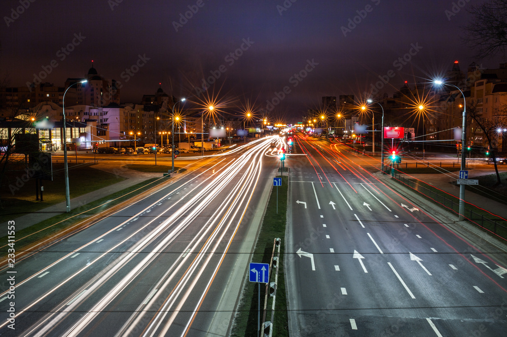 Long Exposure abstract urban background - Speed Traffic at Sundown Time - light trails on motorway highway at night, fantastic sky