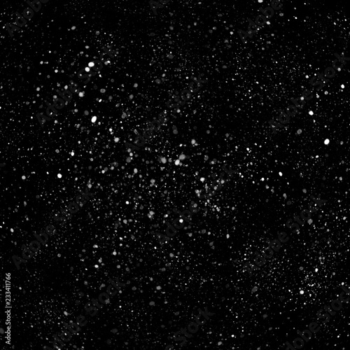 Isolated natural white snow texture effect on black night background. Winter snowflakes. © artistmef