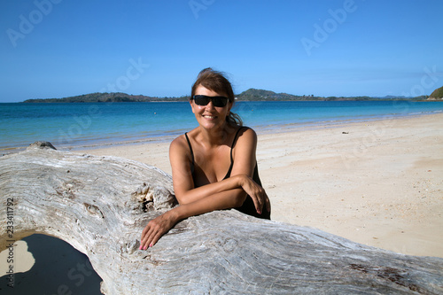 Young woman on the deserted beach of the island Nosy Sakatia