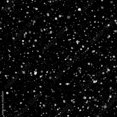 Isolated natural white snow texture effect on black night background. Winter snowflakes. © artistmef