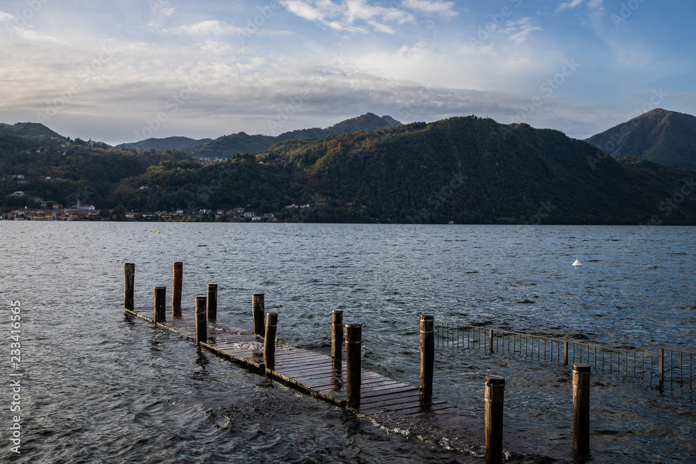 lake in the mountains with a flooded pier