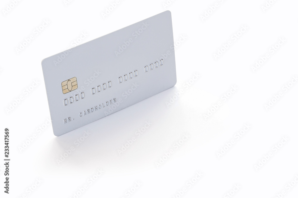 White credit card on white background with natural shadow White credit card on white background with natural shadow