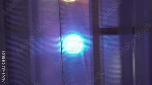 Police car behind curtain