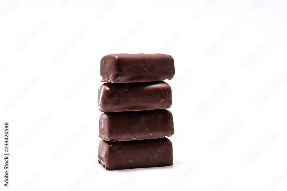 Chocolate candies on white background close up
