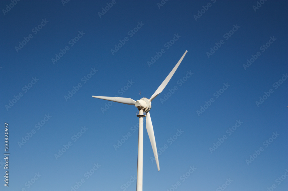 Wind turbine on blue sky without clouds Wind turbine on blue sky without clouds