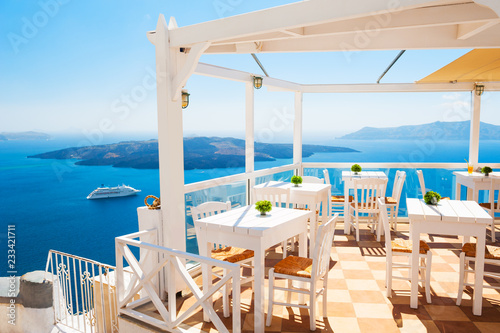 Cafe on the terrace overlooking the sea. Santorini island, Greece