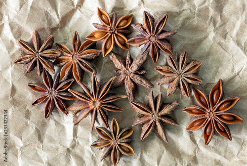 Bulk star anise spice on brown paper