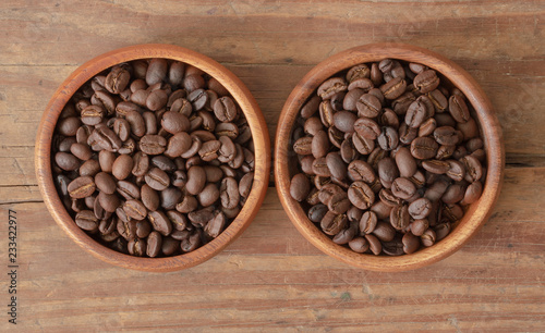 Fototapeta Naklejka Na Ścianę i Meble -  Coffee beans in wood bowls.