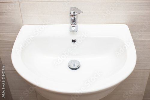 Close-up of ceramic white bathroom sink