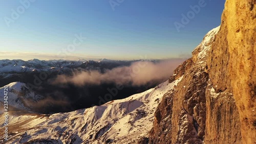 Aerial flight through mountain range in Dolomites, Italy. UHD outdoor footage photo