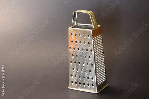 Iron hand grater for vegetables.