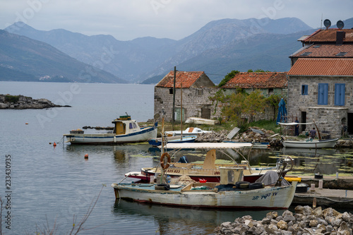 Fishing boat moored on port in fishing village, Karce, Trivet, Montenegro photo