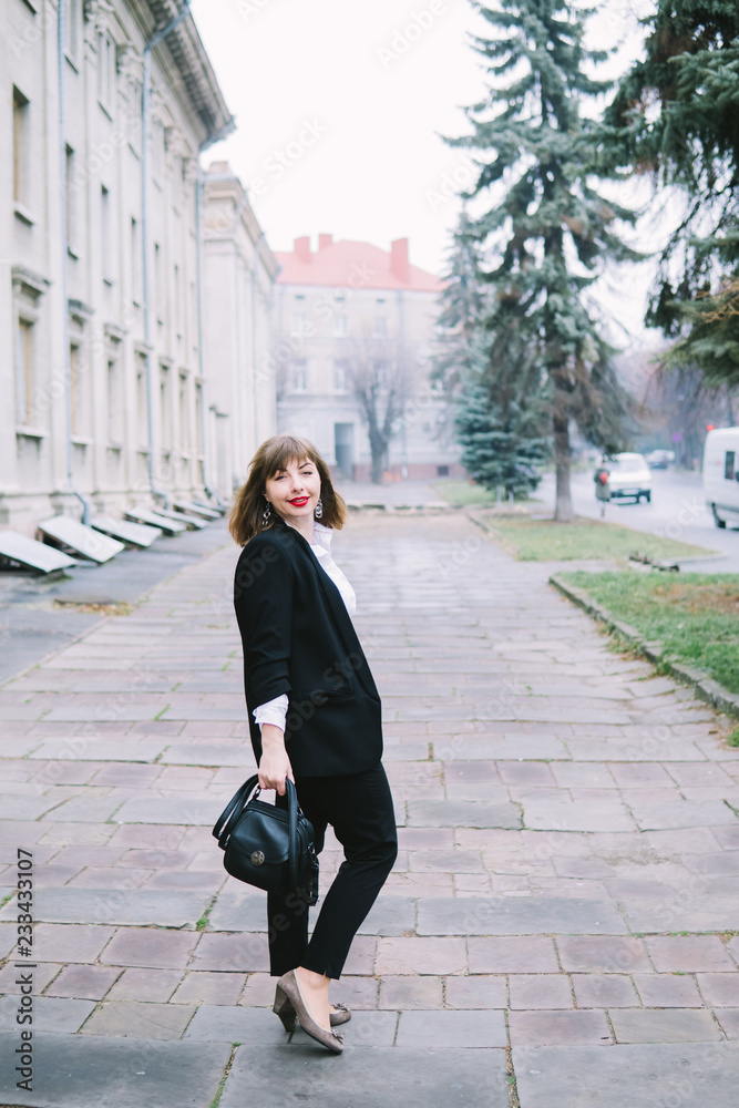 Business Women Style. Woman Going To Work Walking Downstairs. Portrait Of Beautiful Smiling Female In Stylish Office Clothes Going Old Town.