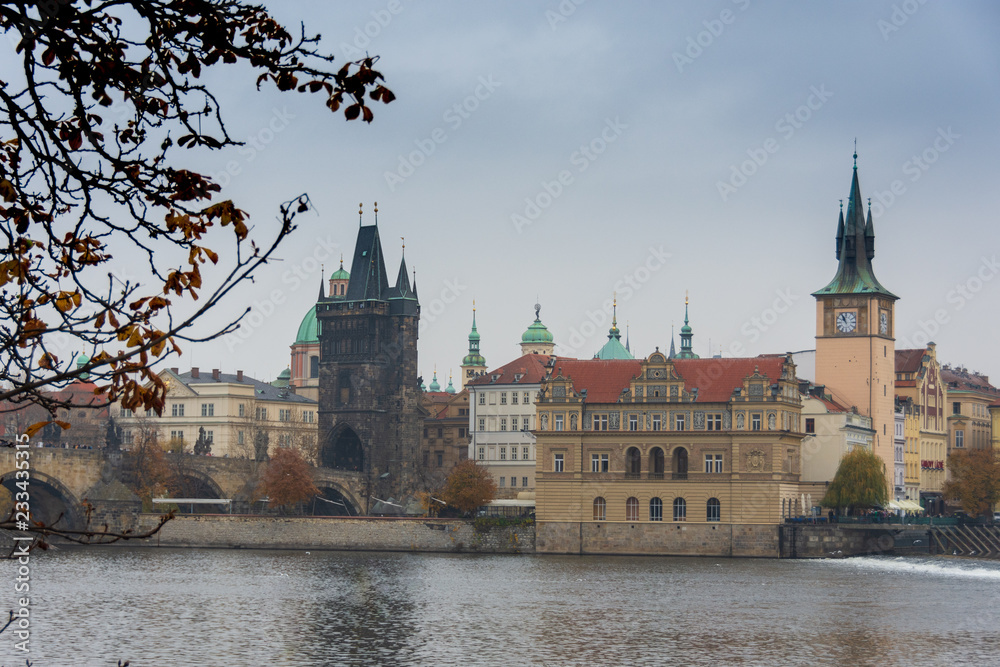Gothic tower of Charles' bridge over the river Vltava and Nove Mesto, Prague, Czech republic