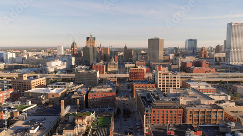 Milwaukee river in downtown, harbor districts of Milwaukee, Wisconsin, United States. Real estate, condos in downtown. Aerial view, drone flying photo