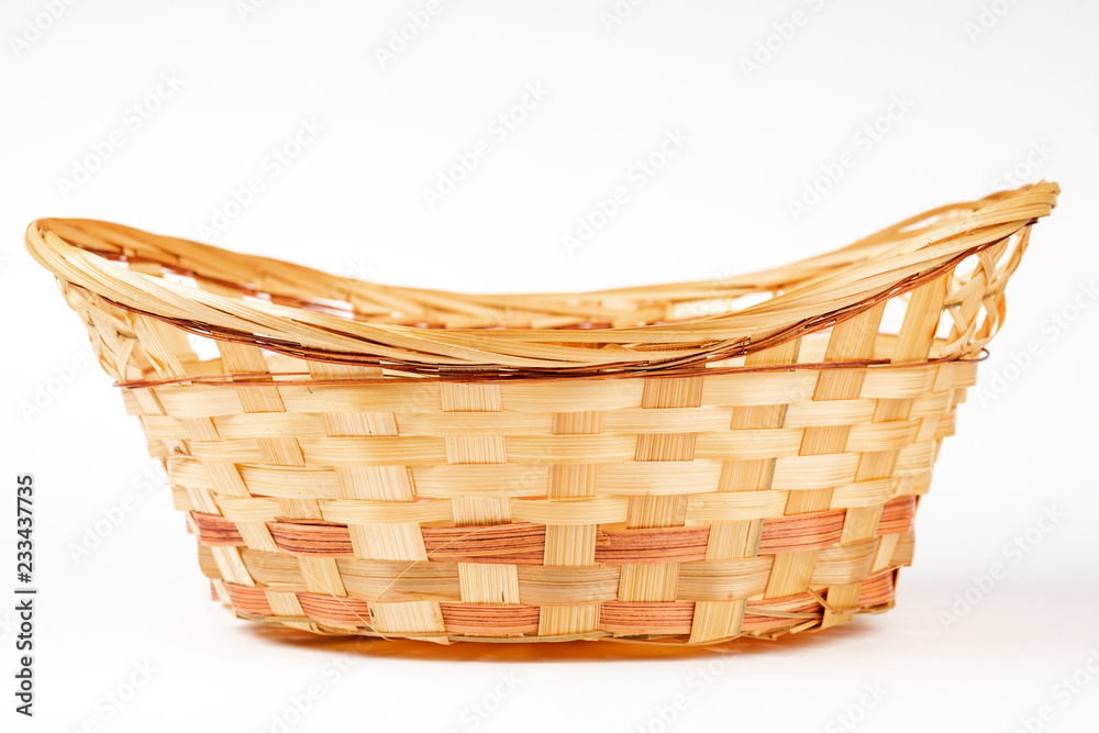 Obraz premium wicker basket isolated on white background