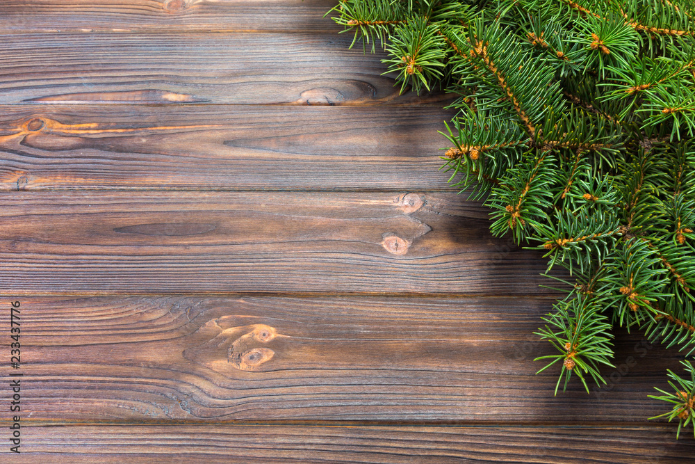 Christmas gray wooden background with fir tree and copy space. top view empty space for your design Christmas gray wooden background with fir tree and copy space. top view empty space for your design