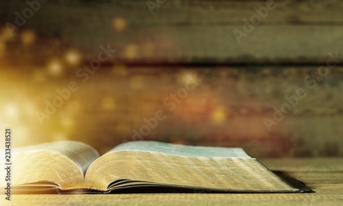 Open bible on desk.