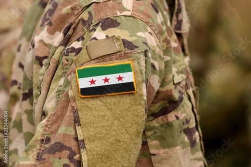 Soldiers arm with Flag used by the Syrian Opposition and Syrian Revolutionary and Opposition Forces