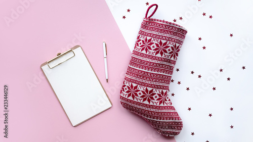 Santa's red sock and note. Concept of christmas.
