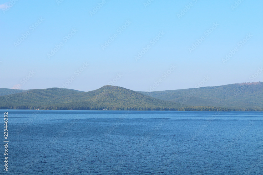 Beautiful view of the lake and the mountains. Background. Landscape. Beautiful view of the lake and the mountains. Background. Landscape.