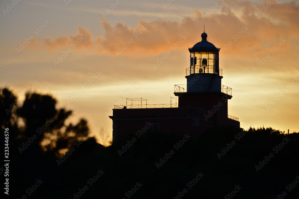 Lighthouse Capo Spartivento at sunset, Sardinia island, Italy