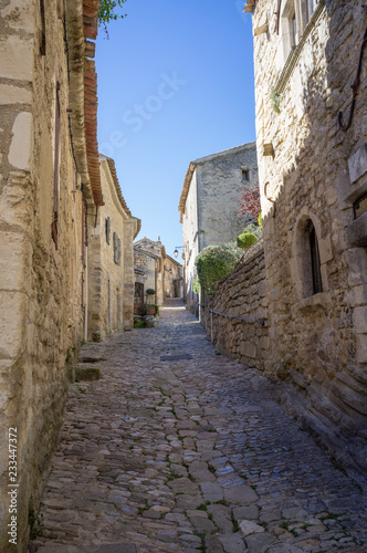 Fototapeta Naklejka Na Ścianę i Meble -  Authentic cobblestone street in Lacoste village, Vaucluse, France