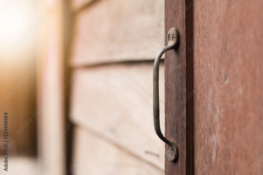Old window's handle on old wooden window Old window's handle on old wooden window
