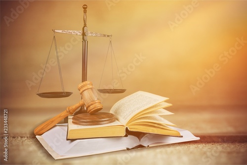 Justice Scales and books and wooden gavel on table. Justice