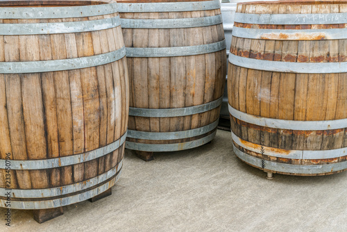 old traditional oversize wooden barrels for aging red pinot noir grapes for barrique wine