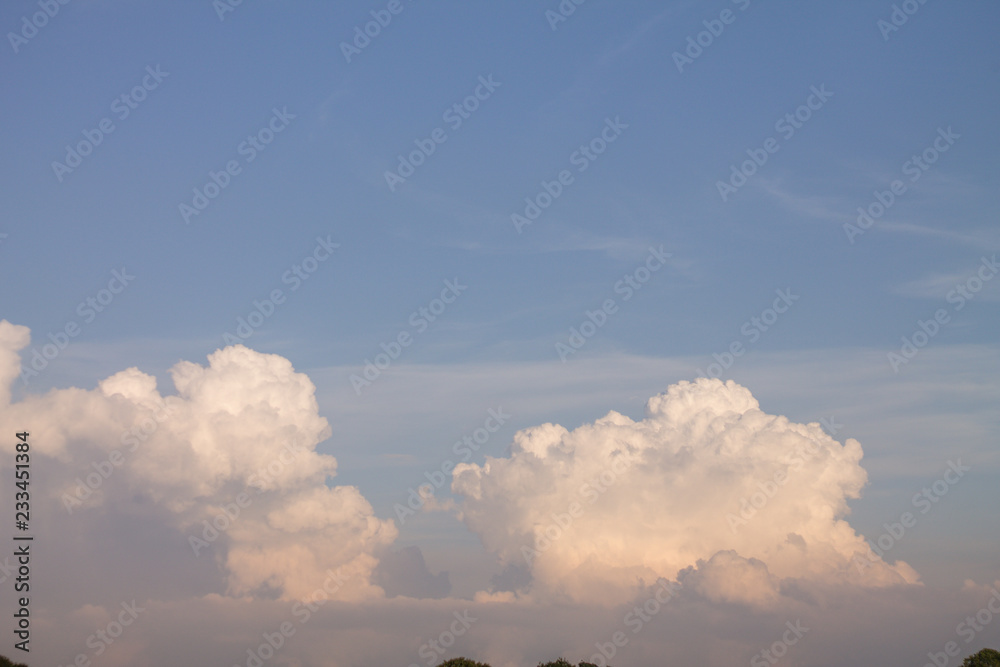 blue sky and white huge fluffy clouds on it blue sky and white huge fluffy clouds on it
