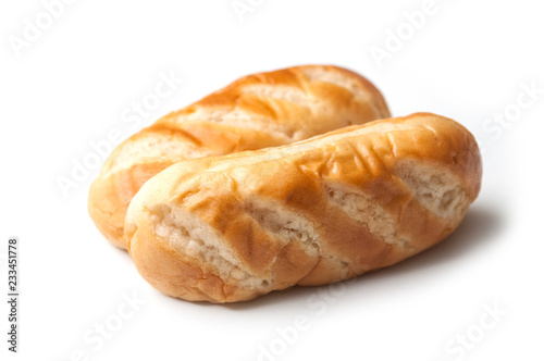 closeup of two milk breads on white background