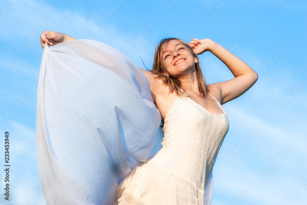 happy young girl on the sky background happy young girl on the sky background