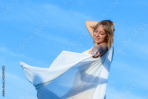 happy young girl on the sky background