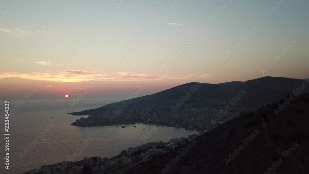 Aerial view of beautiful sunset over the city of Saranda, Albania (Albanian Riviera) Aerial view of beautiful sunset over the city of Saranda, Albania (Albanian Riviera)