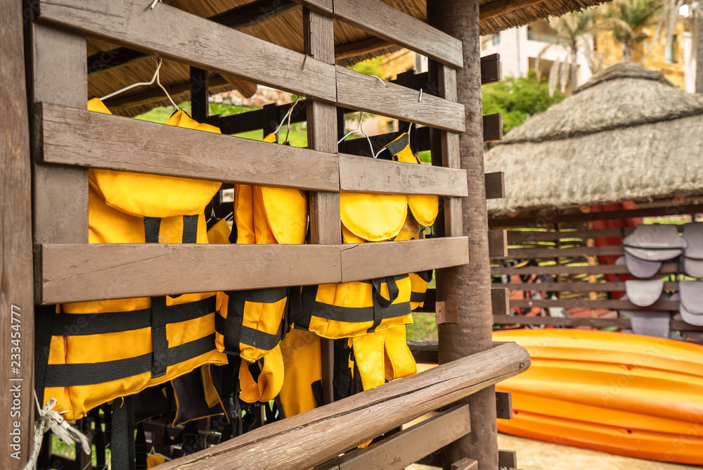 life jackets neatly hanging in a specialized place