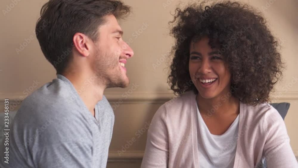 Happy couple talking at home Happy couple talking at home
