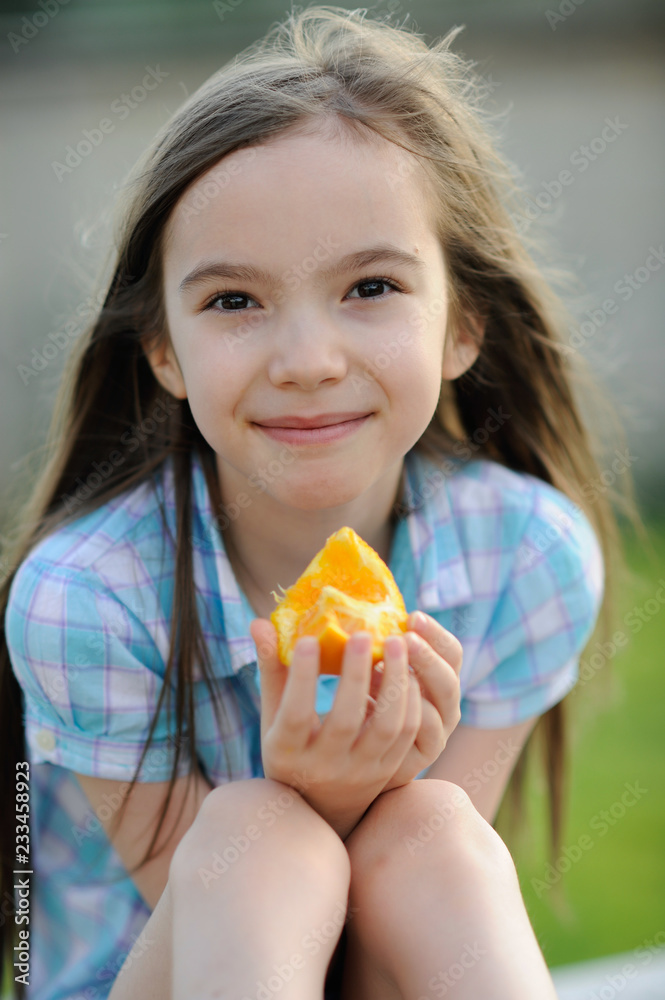 Girl Eating Orange