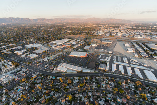 Konstfotografi Late afternoon aerial view of homes, industrial buildings, tarmac and runway at Van Nuys airport in the San Fernando Valley