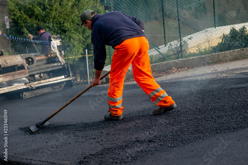 laying new asphalt on disconnected road