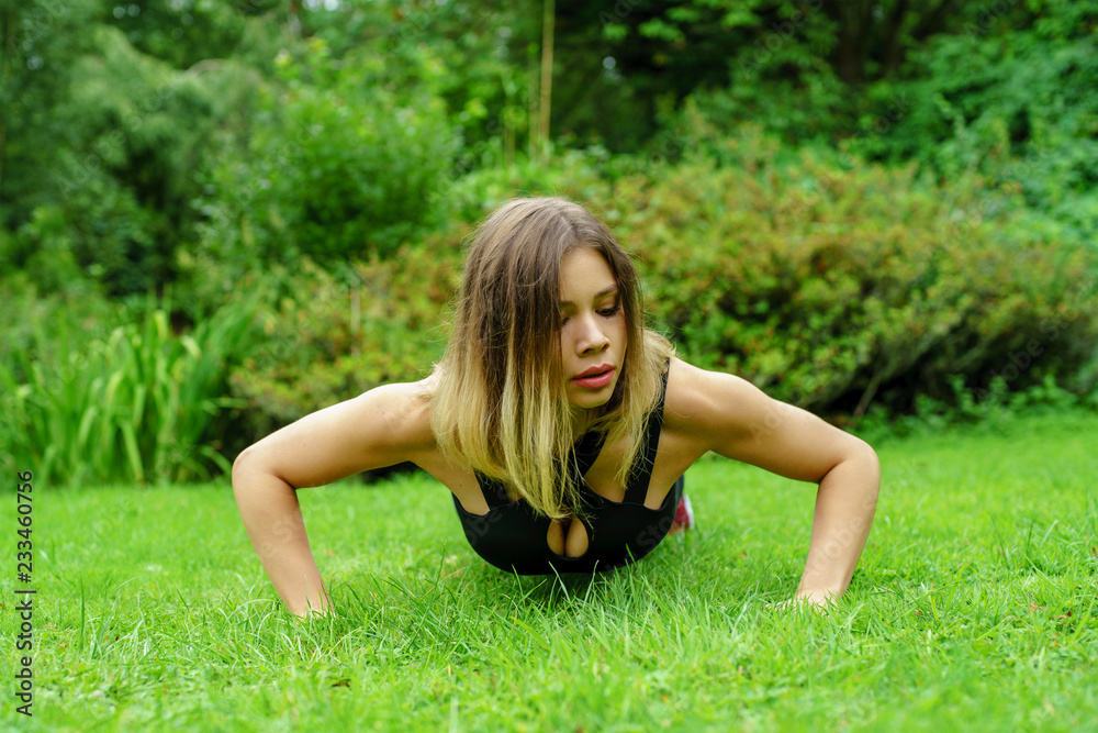 woman doing push ups exercise woman doing push ups exercise