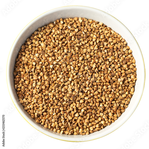 Bowl of Dry Raw Buckwheat Grains Isolated on White Background. Russian Kasha or Uncooked Pseudocereal Buck Wheat with Clipping Path