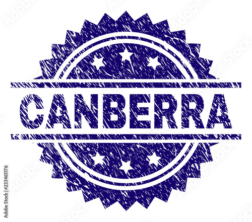 CANBERRA stamp seal watermark with distress style. Blue vector rubber print of CANBERRA caption with grunge texture.