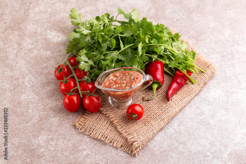 Traditional mexican red spicy sauce with ingredients photo