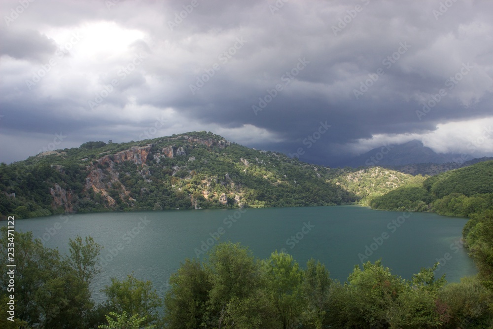 Ziros lake in the afternoon at summer before a big storm. Ziros lake is a lake in Preveza in the Epirus region of Greece.