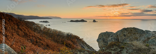 the coast of sea at sunrise photo