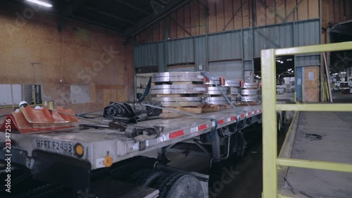 Delvering heavy steel coils on flatbed trailer photo
